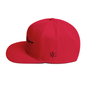 Left Side of Red Snapback Cap that has SG with an Arrow